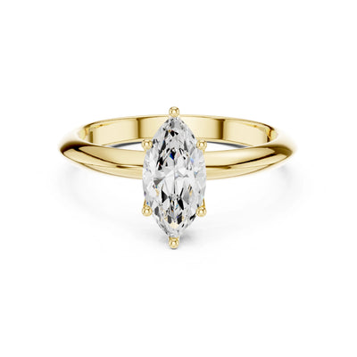 Gold ring with a marquise-shaped moissanite diamond on a white background