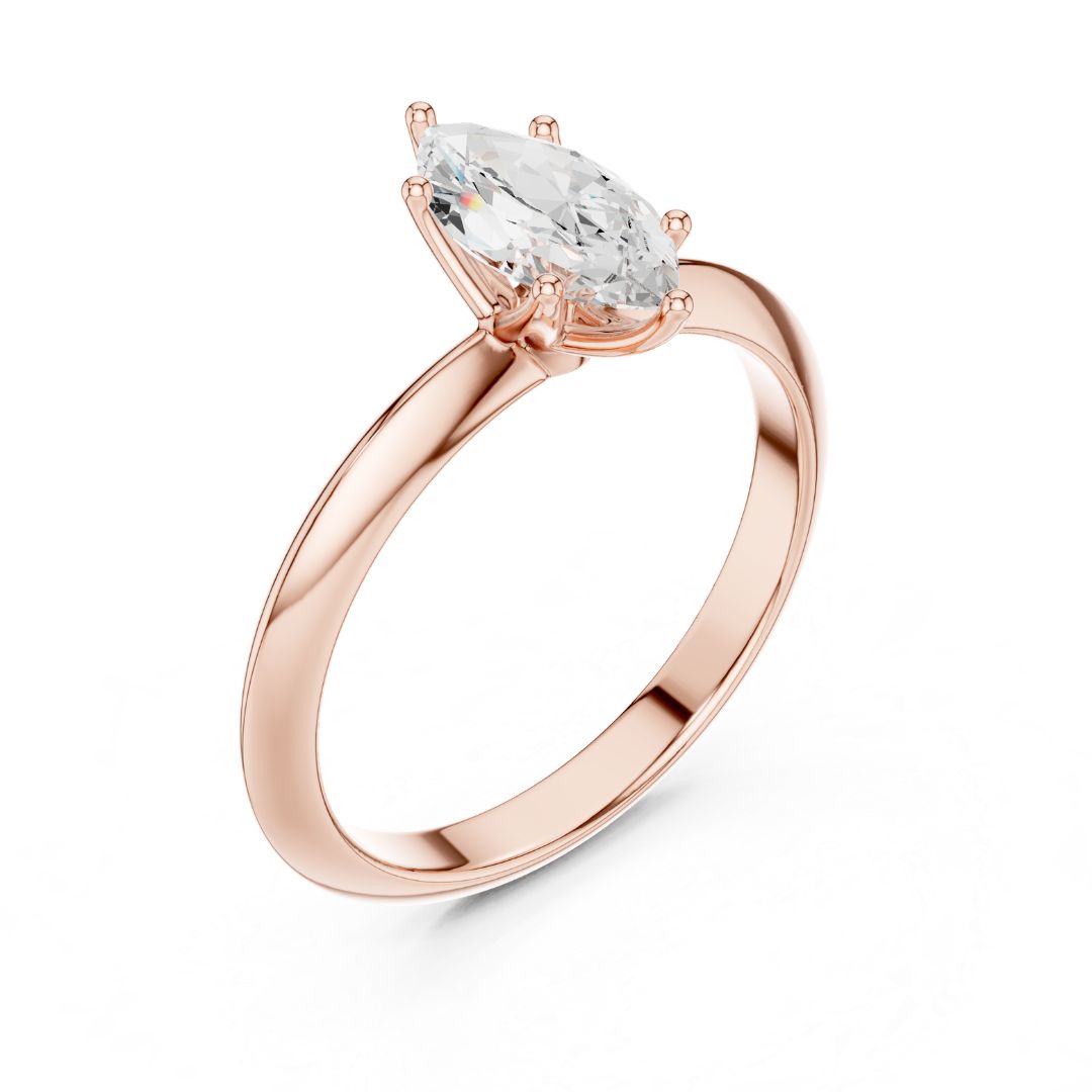 Rose gold ring with a clear moissanite  gemstone on a white background