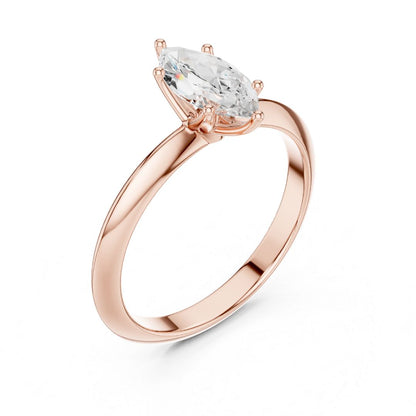 Rose gold ring with a clear moissanite  gemstone on a white background