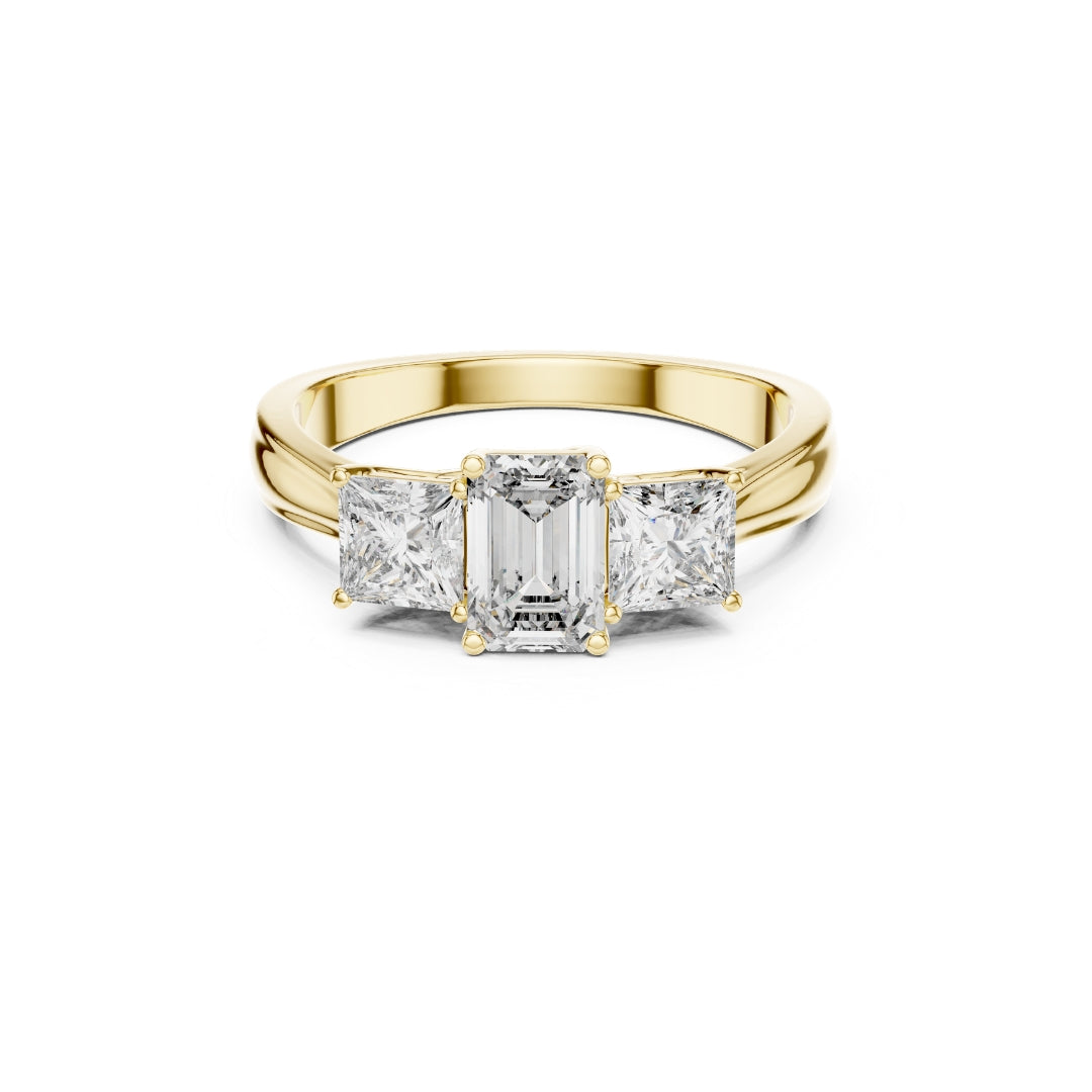 Gold ring with emerald-cut moissanite diamonds on a white background