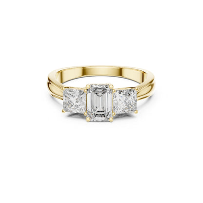 Gold ring with emerald-cut moissanite diamonds on a white background