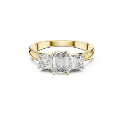 Gold ring with emerald-cut moissanite diamonds on a white background