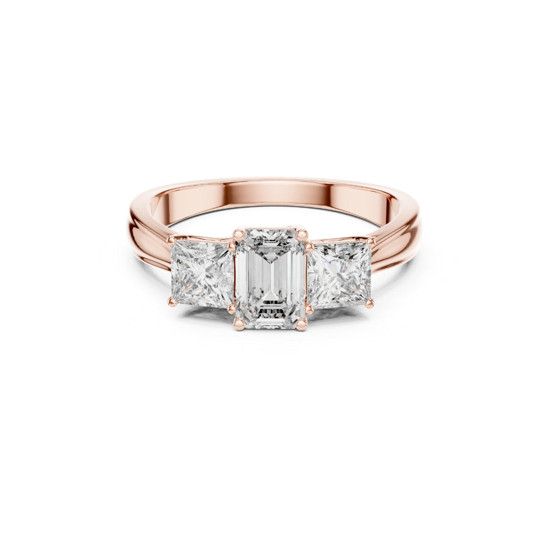 Rose gold ring with emerald-cut moissanite diamond on a white background