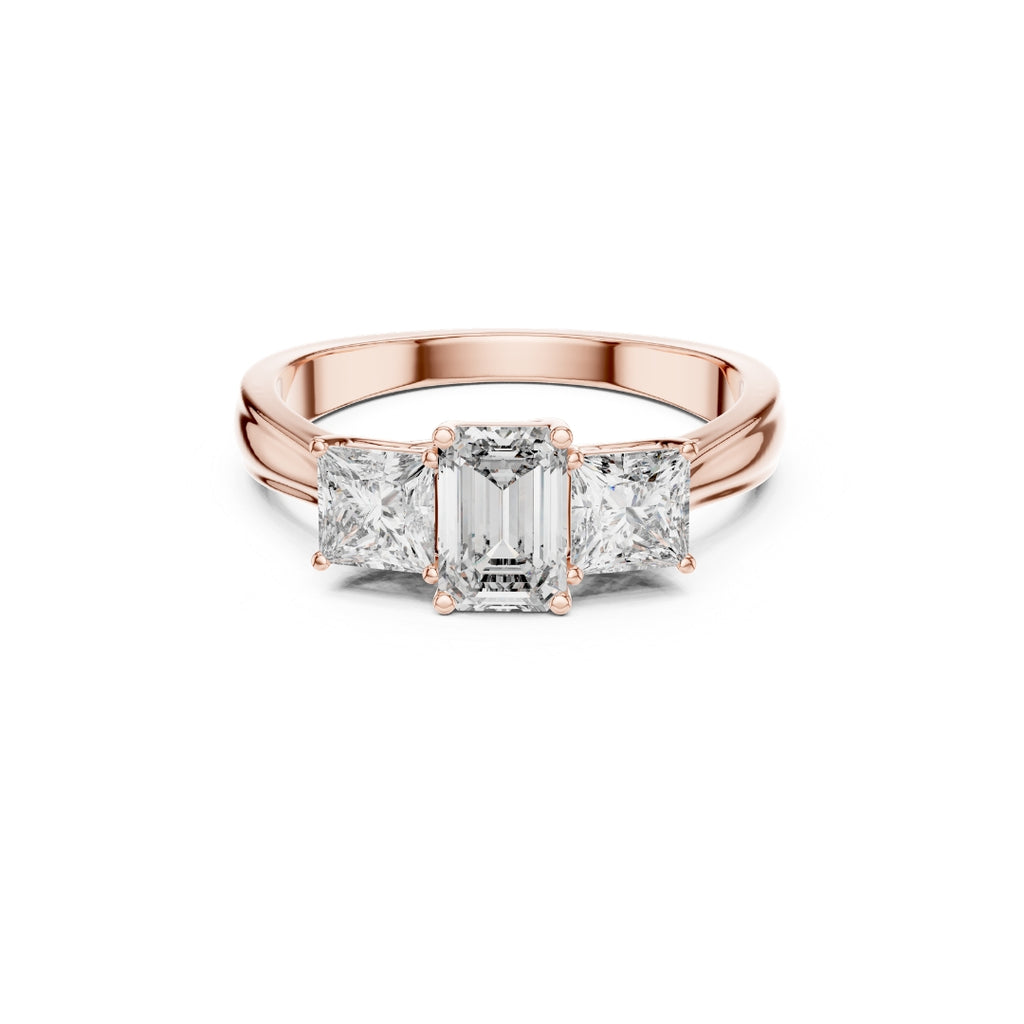 Rose gold ring with emerald-cut moissanite diamond on a white background