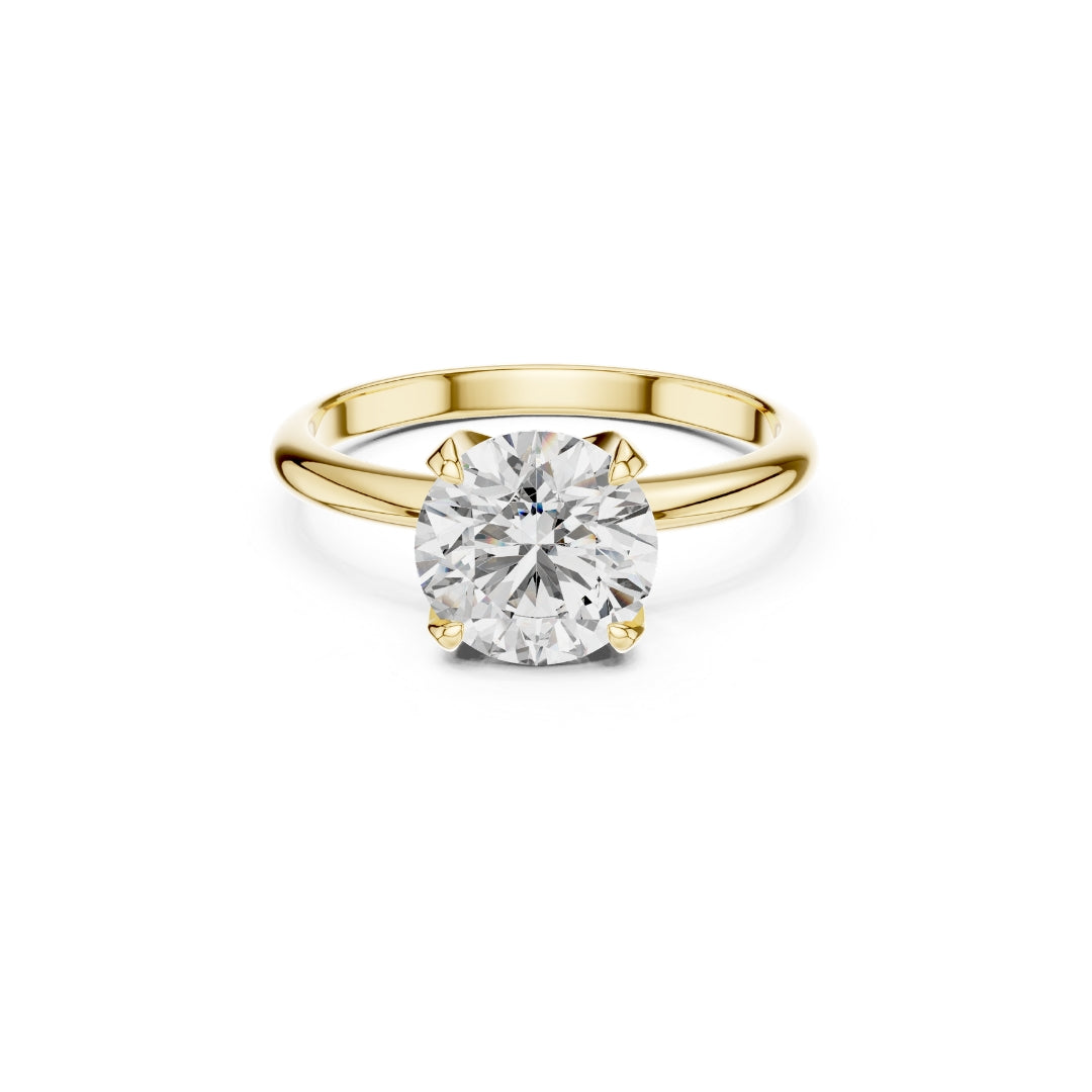 Gold ring with a 1ct Moissanite diamond on a white background