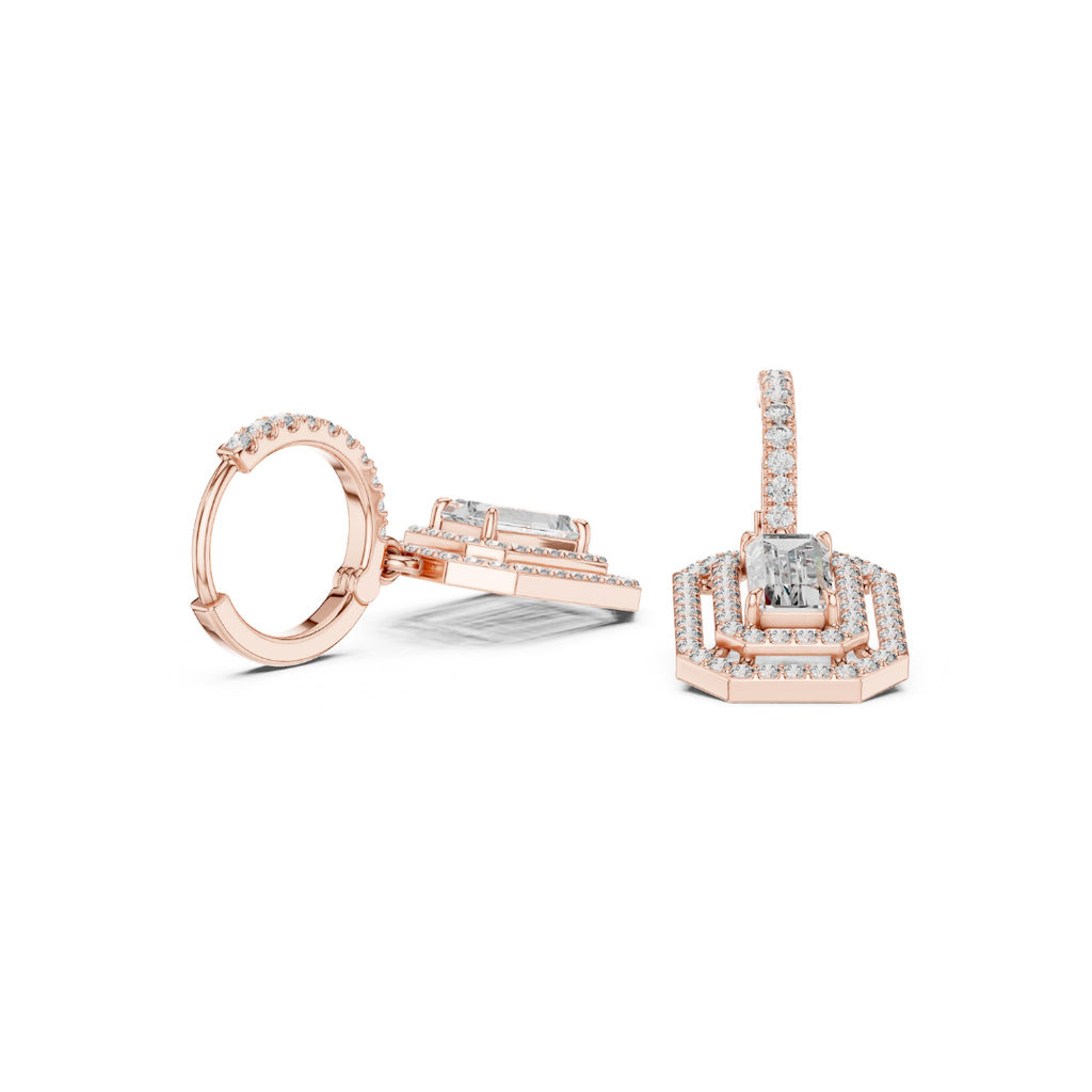 Rose gold earing and moissanite diamond accents on a white background