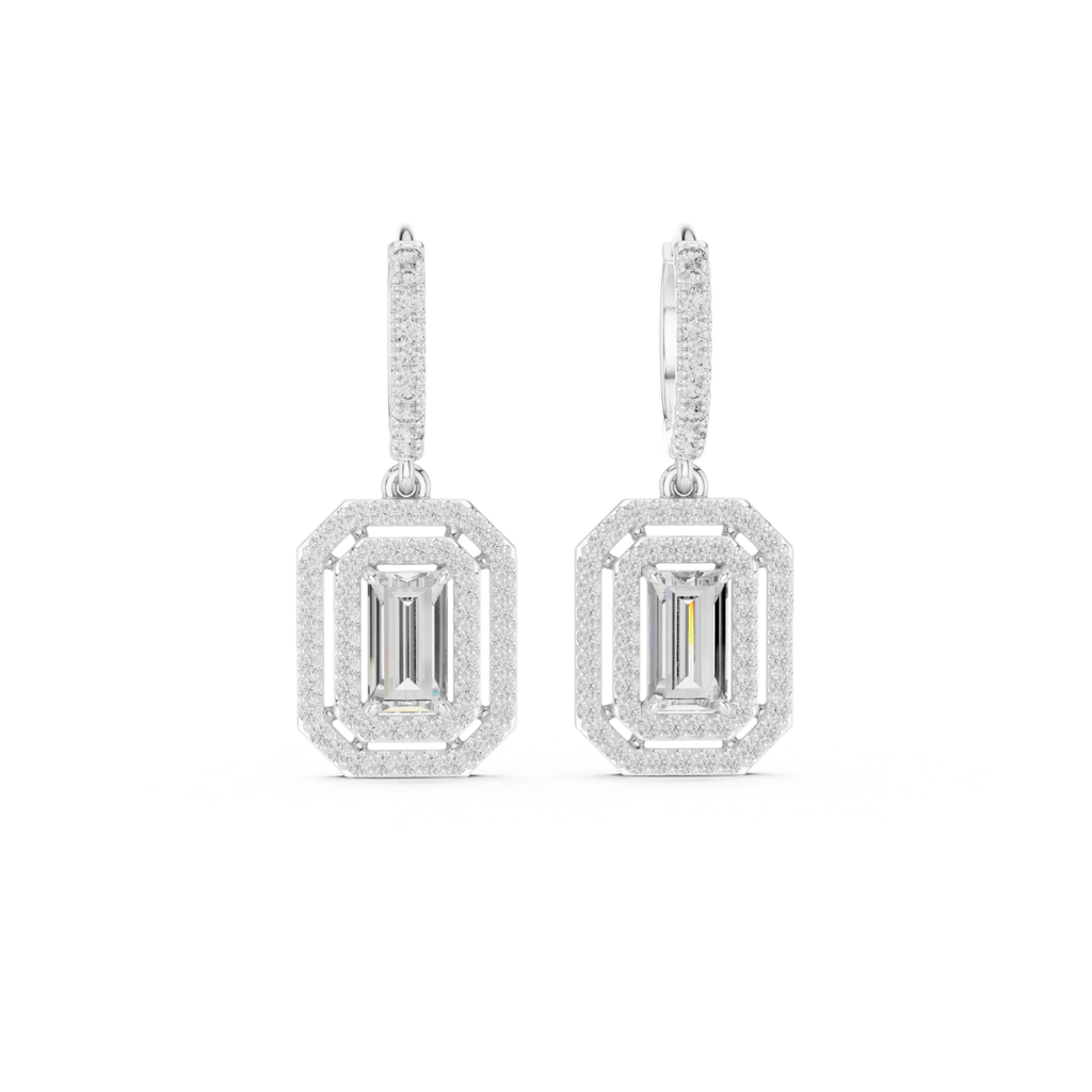 Pair of moissanite diamond earrings on a white background