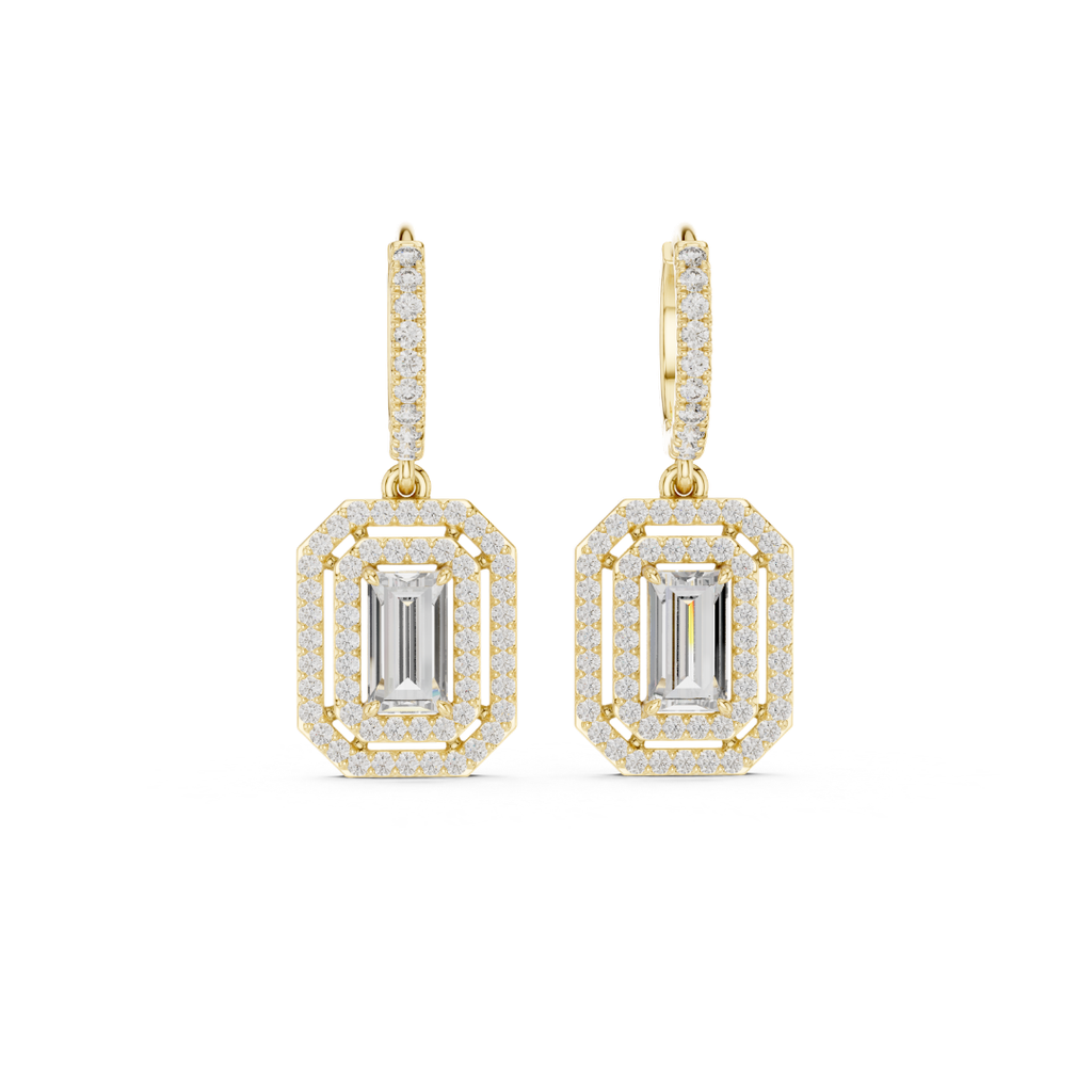 Gold earrings with emerald-cut moissainte gemstones on a white background