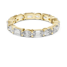 Load image into Gallery viewer, Gold ring with emerald-cut moissanite diamonds on a white background