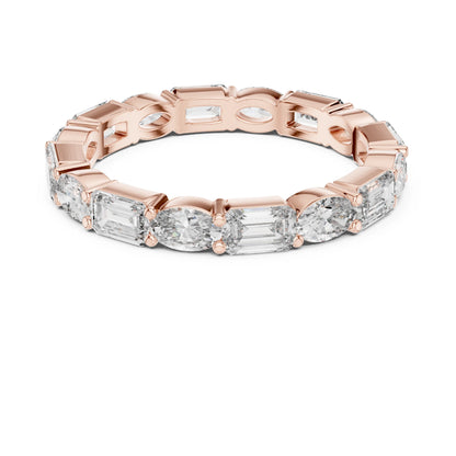 Rose gold ring with emerald-cut moissanite diamonds on a white background