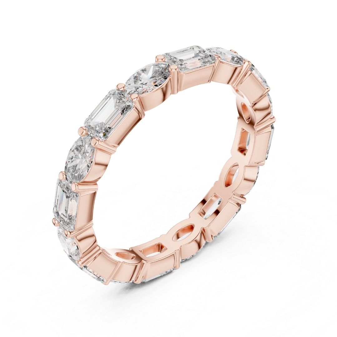Rose gold ring with clear moissanite gemstones on a white background