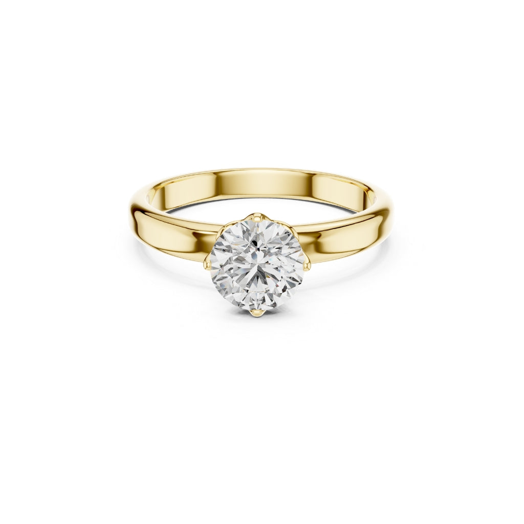 Gold ring with a 1ct moissanite diamond on a white background