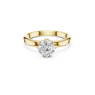Gold ring with a 1ct moissanite diamond on a white background