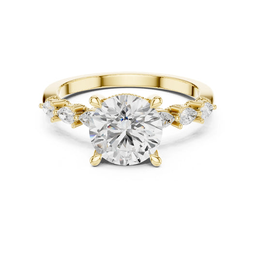 Gold ring with a large moissanite diamond and smaller diamonds on the sides against a white background