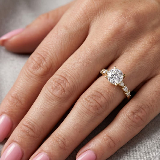 moissanite Diamond ring on a person's finger with a neutral background