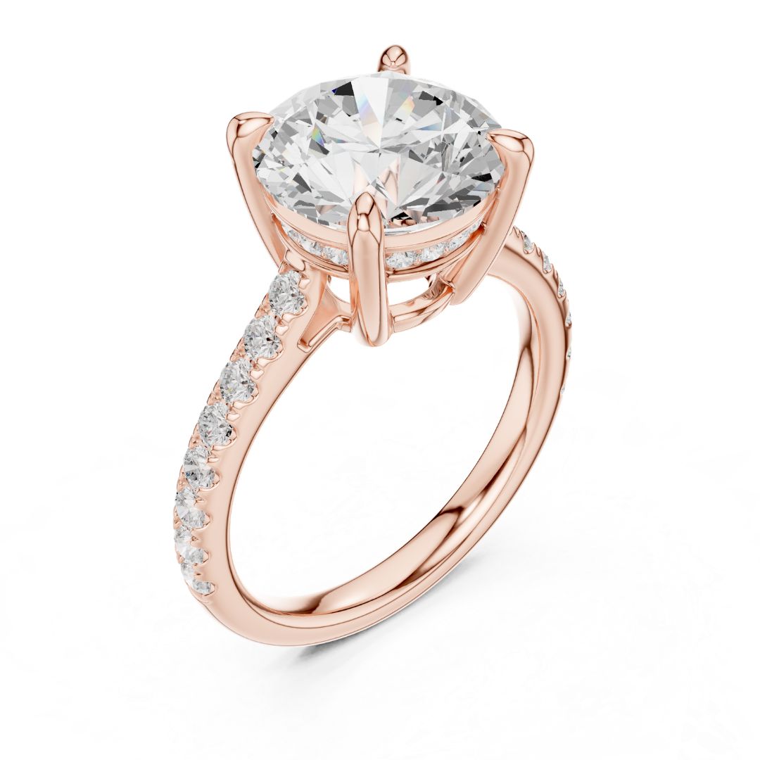 Rose gold ring with a large moissanite diamond and smaller diamonds on the band against a white background