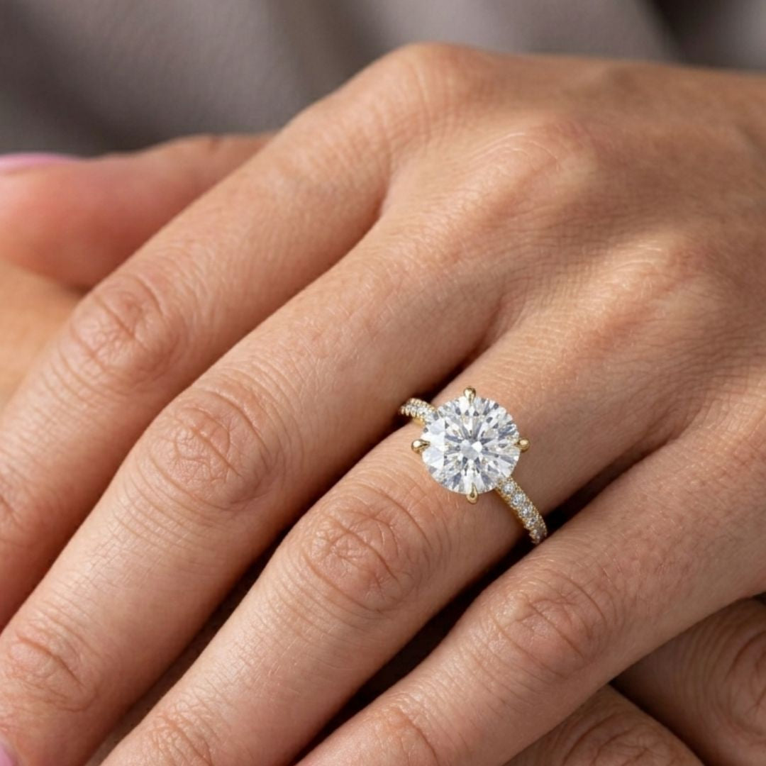 moissanite Diamond ring on a person's finger with a blurred background