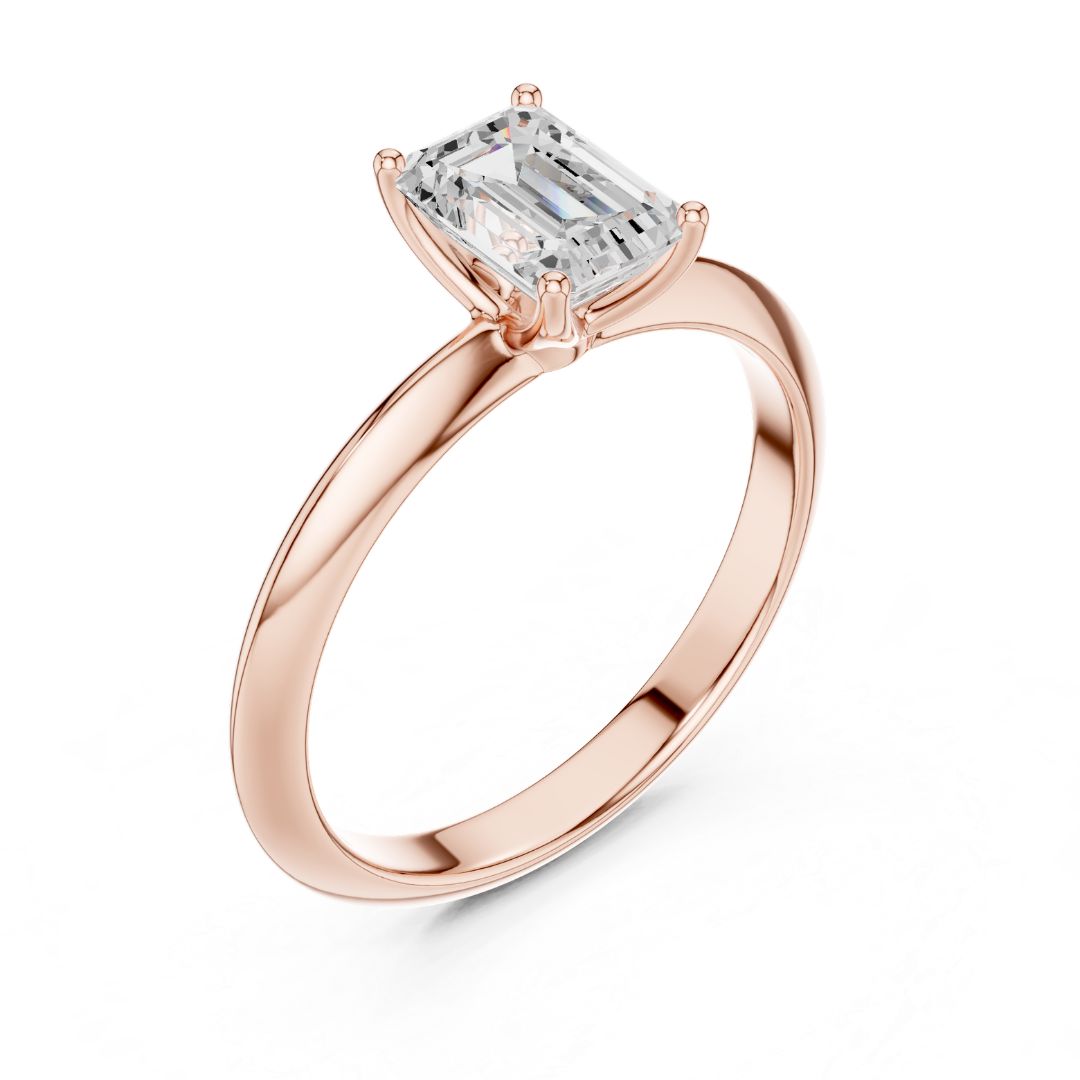 Rose gold ring with a rectangular moissanite diamond on a white background