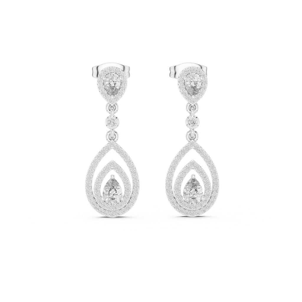 Pair of silver teardrop earrings with moissanite clear gemstones on a white background