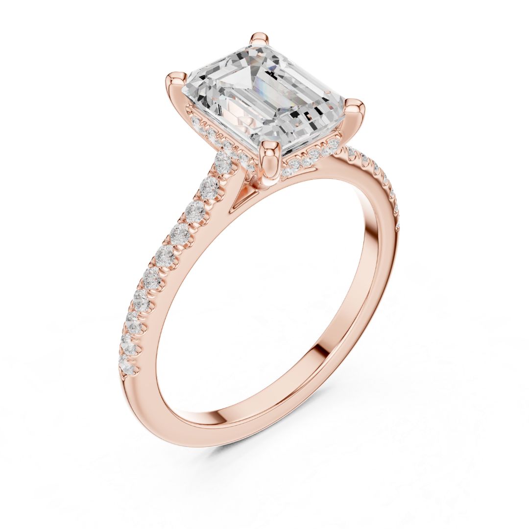 Rose gold ring with a large moissanite  diamond and smaller diamonds on the band against a white background