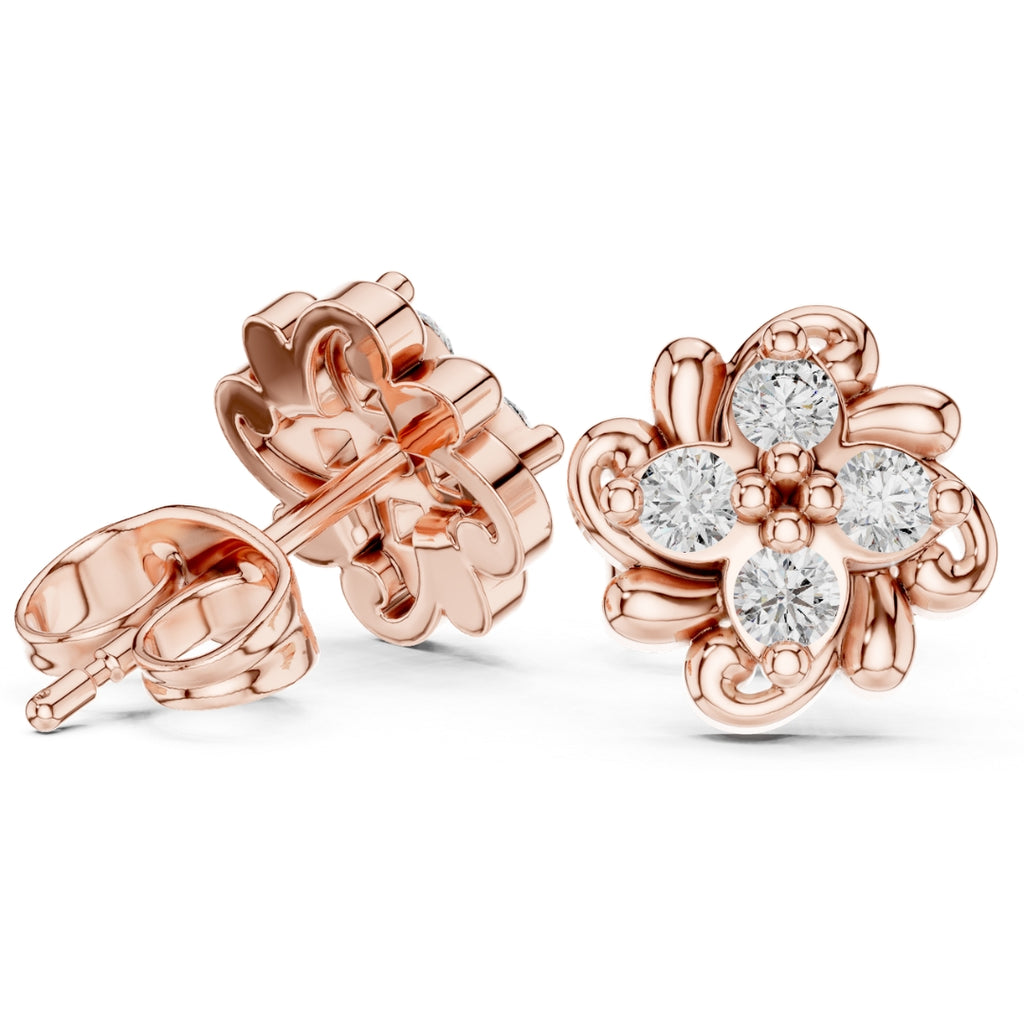 Rose gold earrings with Moissanite diamond accents on a white background