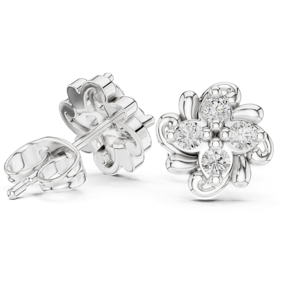 Silver flower-shaped earrings with clear moissanite gemstones on a white background