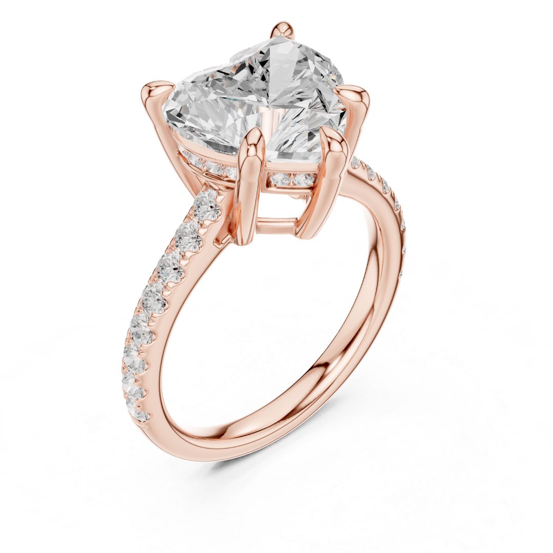 Rose gold ring with a large moissanite diamond and smaller diamonds on the band against a white background