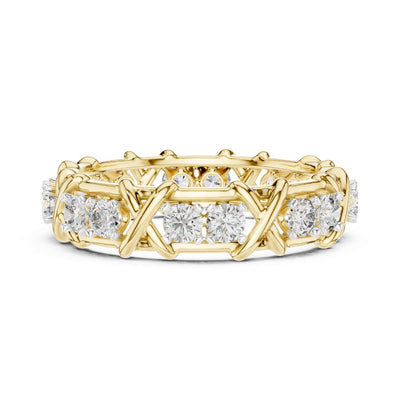 Gold ring with moissanite diamond accents on a white background