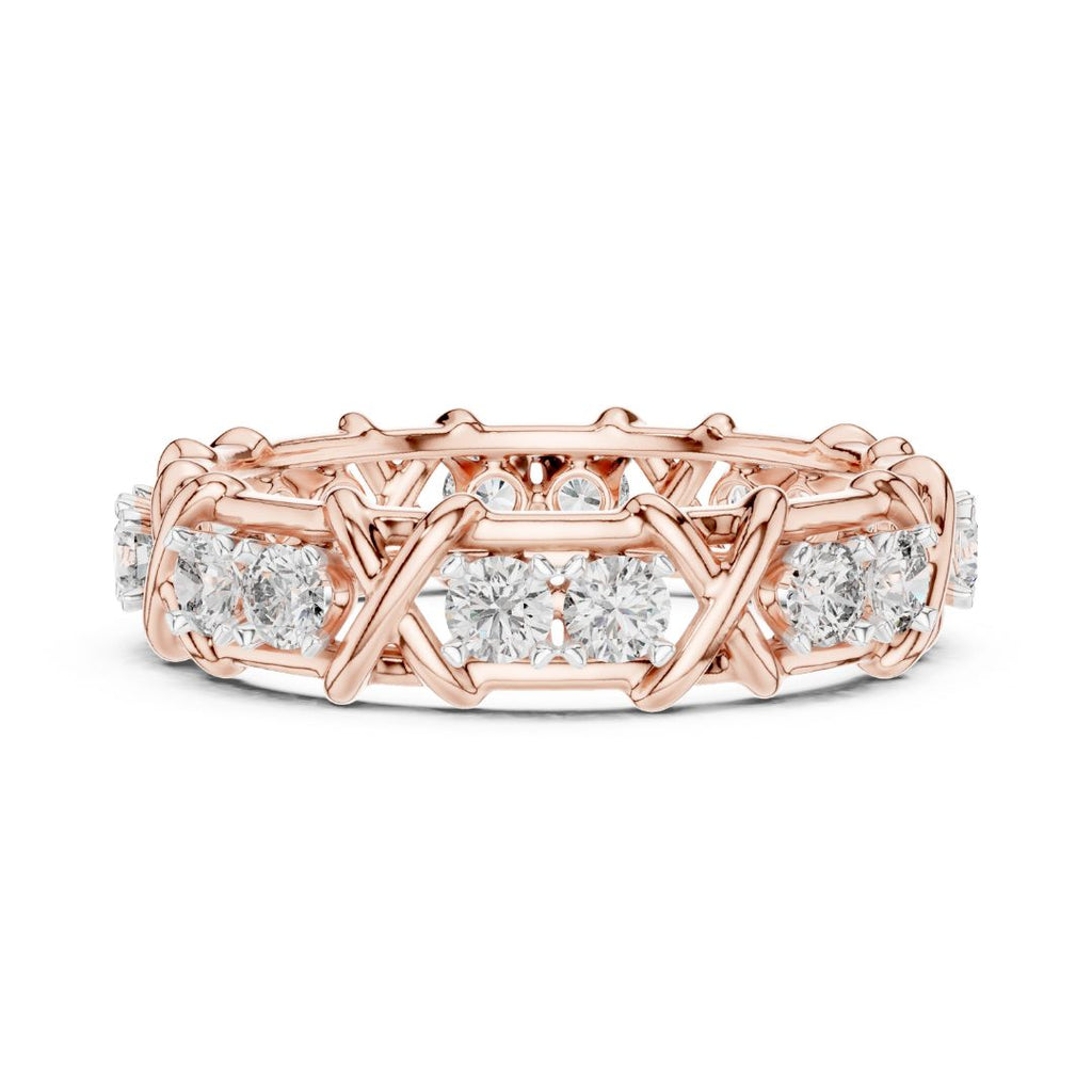 Rose gold ring with moissanite diamond accents on a white background