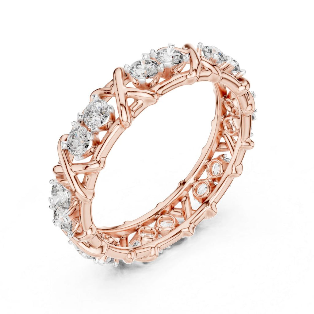 Rose gold ring with moissanite diamond accents on a white background