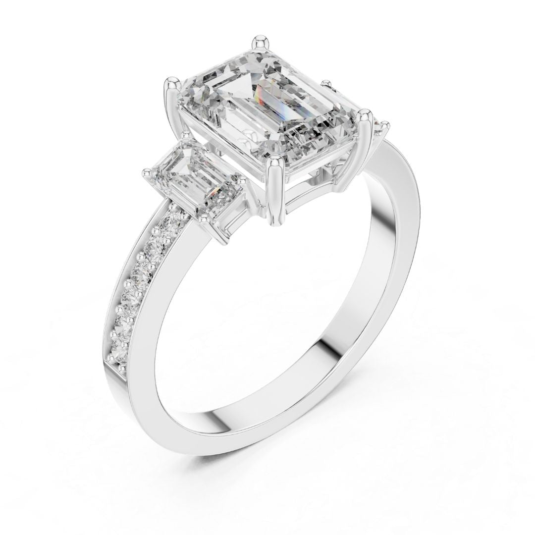Diamond ring with emerald-cut and baguette-cut moissanite diamonds on a white background