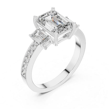 Diamond ring with emerald-cut and baguette-cut moissanite diamonds on a white background