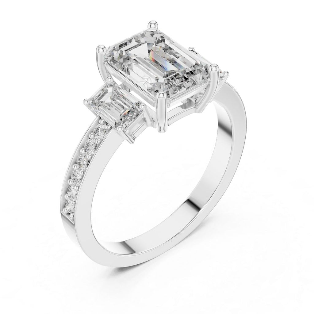 Diamond ring with emerald-cut and baguette-cut moissanite diamonds on a white background