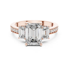 Load image into Gallery viewer, Rose gold ring with emerald-cut moissanite diamonds on a white background