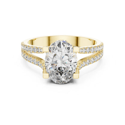Gold ring with a large moissanite diamond and smaller diamonds on the band against a white background