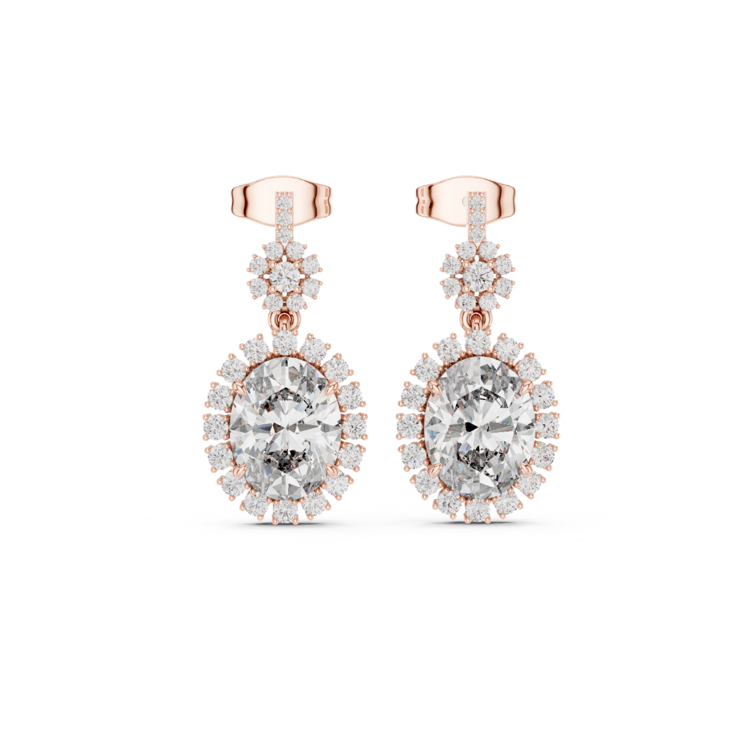 Rose gold earrings with clear Moissanitte gemstones on a white background