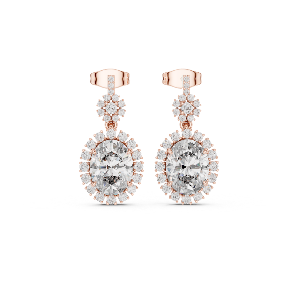 Rose gold earrings with clear Moissanitte gemstones on a white background