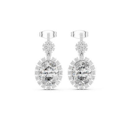 Pair of moissanite diamond earrings on a white background