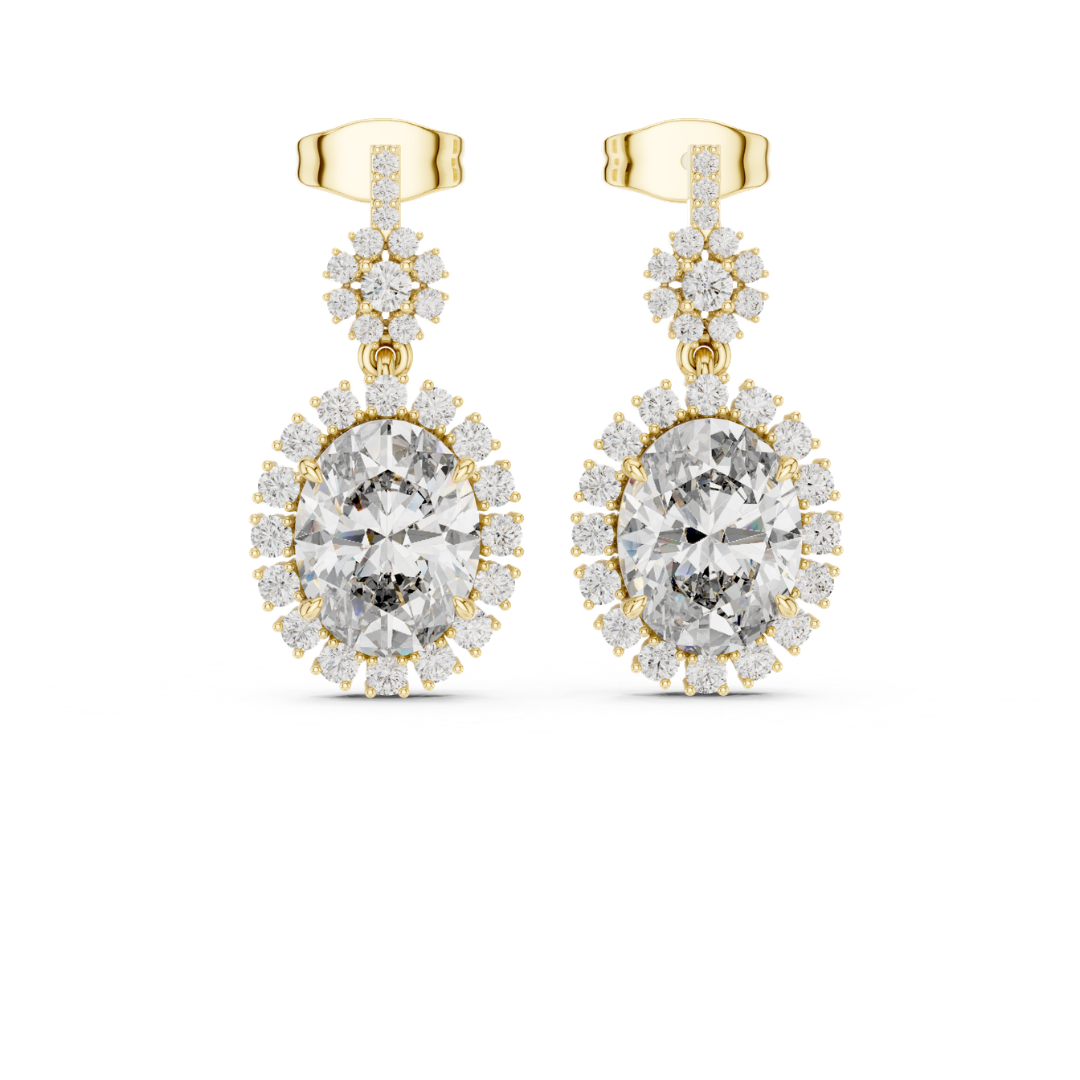 Gold earrings with clear moissanite  gemstones on a white background