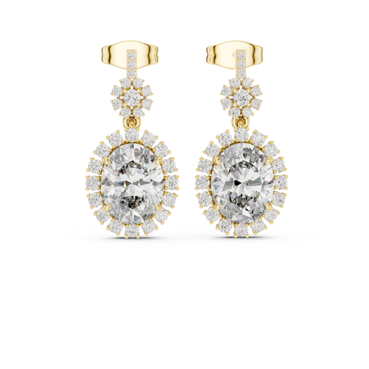 Gold earrings with clear moissanite  gemstones on a white background