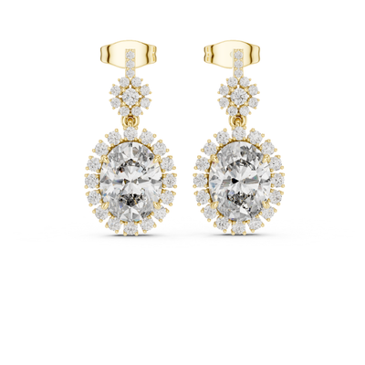 Gold earrings with clear moissanite  gemstones on a white background
