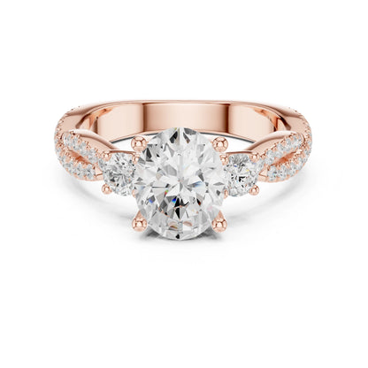 Rose gold ring with a large moissanite diamond and smaller diamonds on the band against a white background