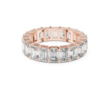 Load image into Gallery viewer, Rose gold ring with emerald-cut Moissanite diamonds on a white background