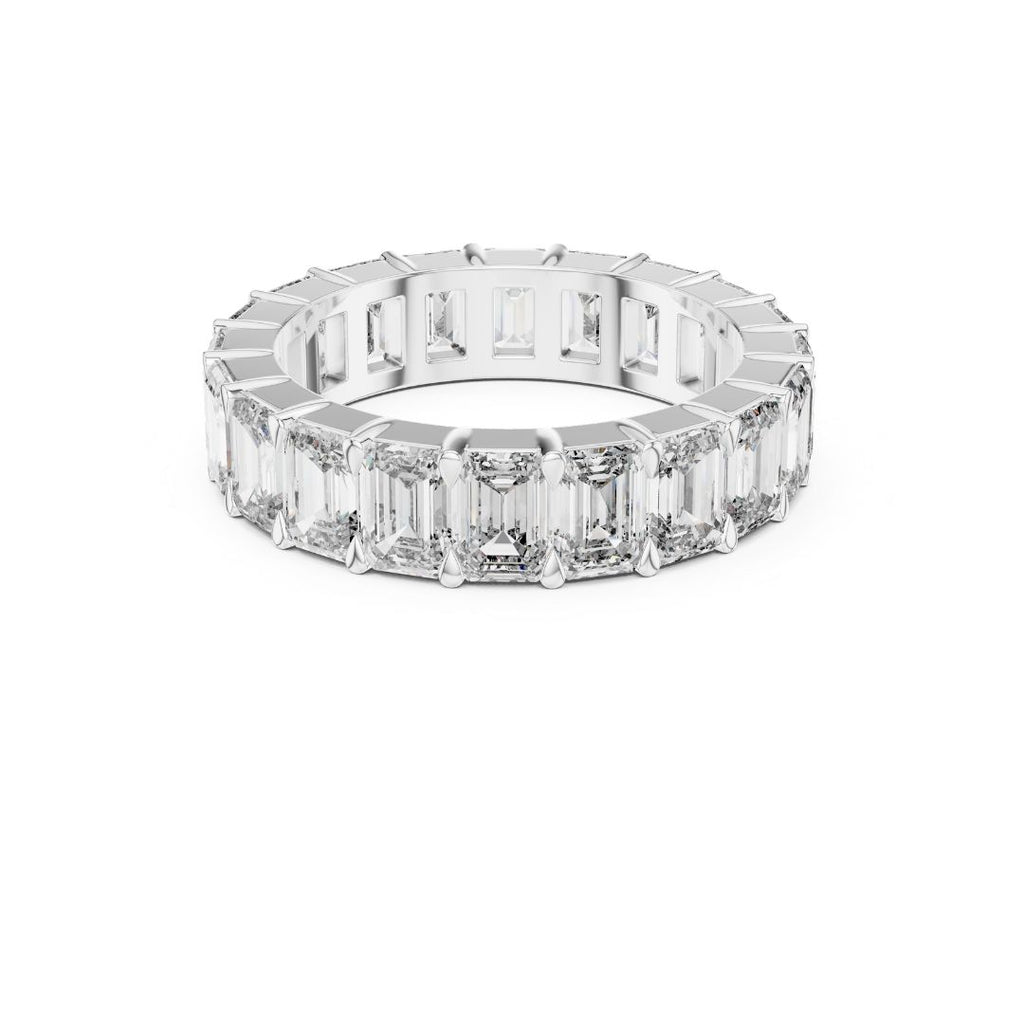 Diamond ring with emerald-cut Moissanite stones on a white background