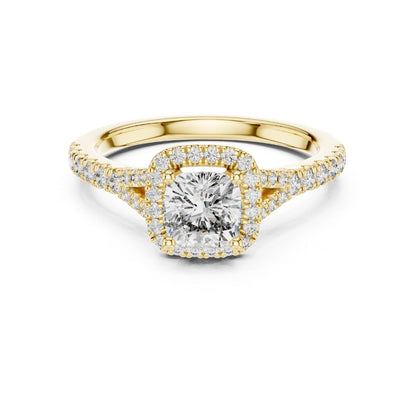 Gold ring with a moissanite diamond on a white background