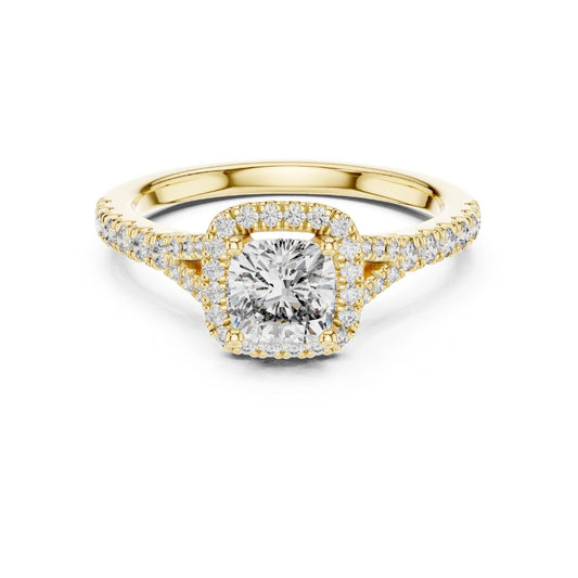 Gold ring with a moissanite diamond on a white background