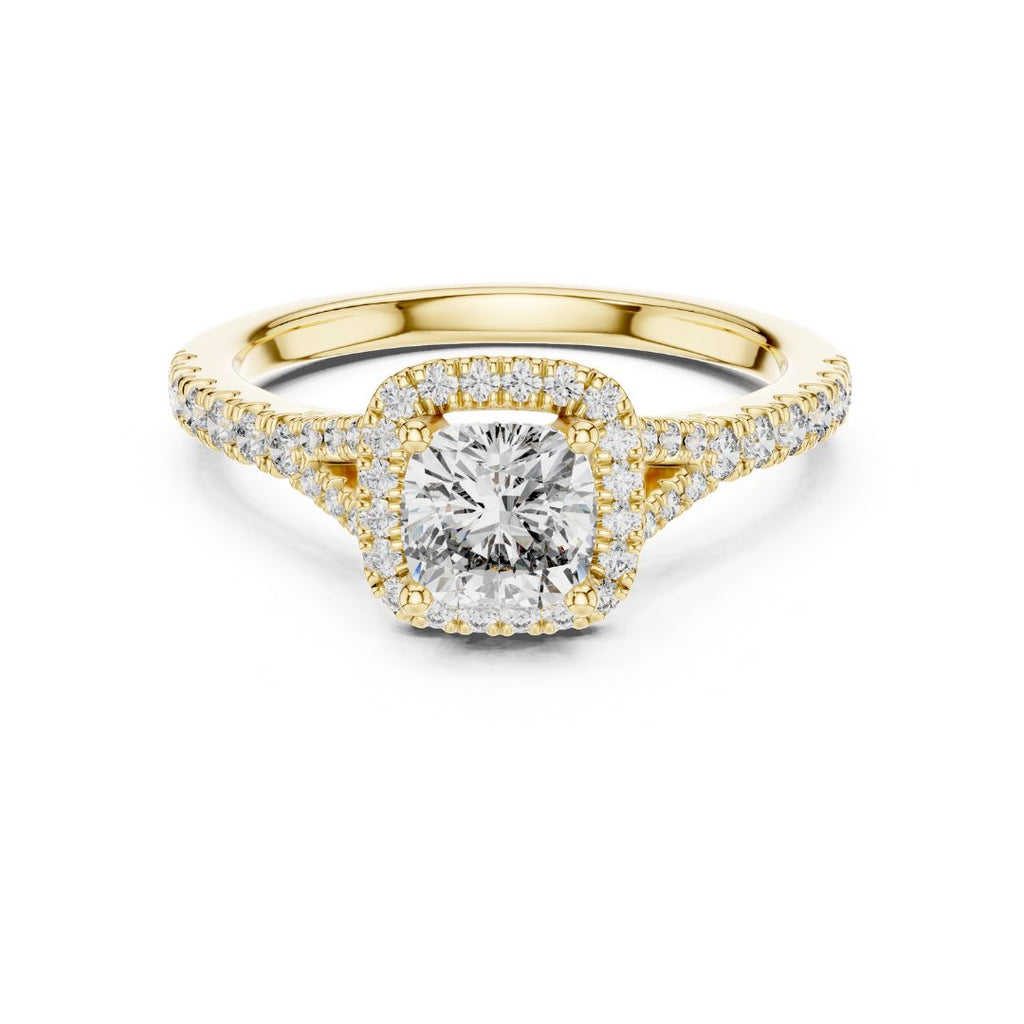 Gold ring with a moissanite diamond on a white background