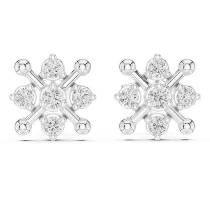 Snowflake-shaped silver earrings with clear moissanite gemstones on a white background