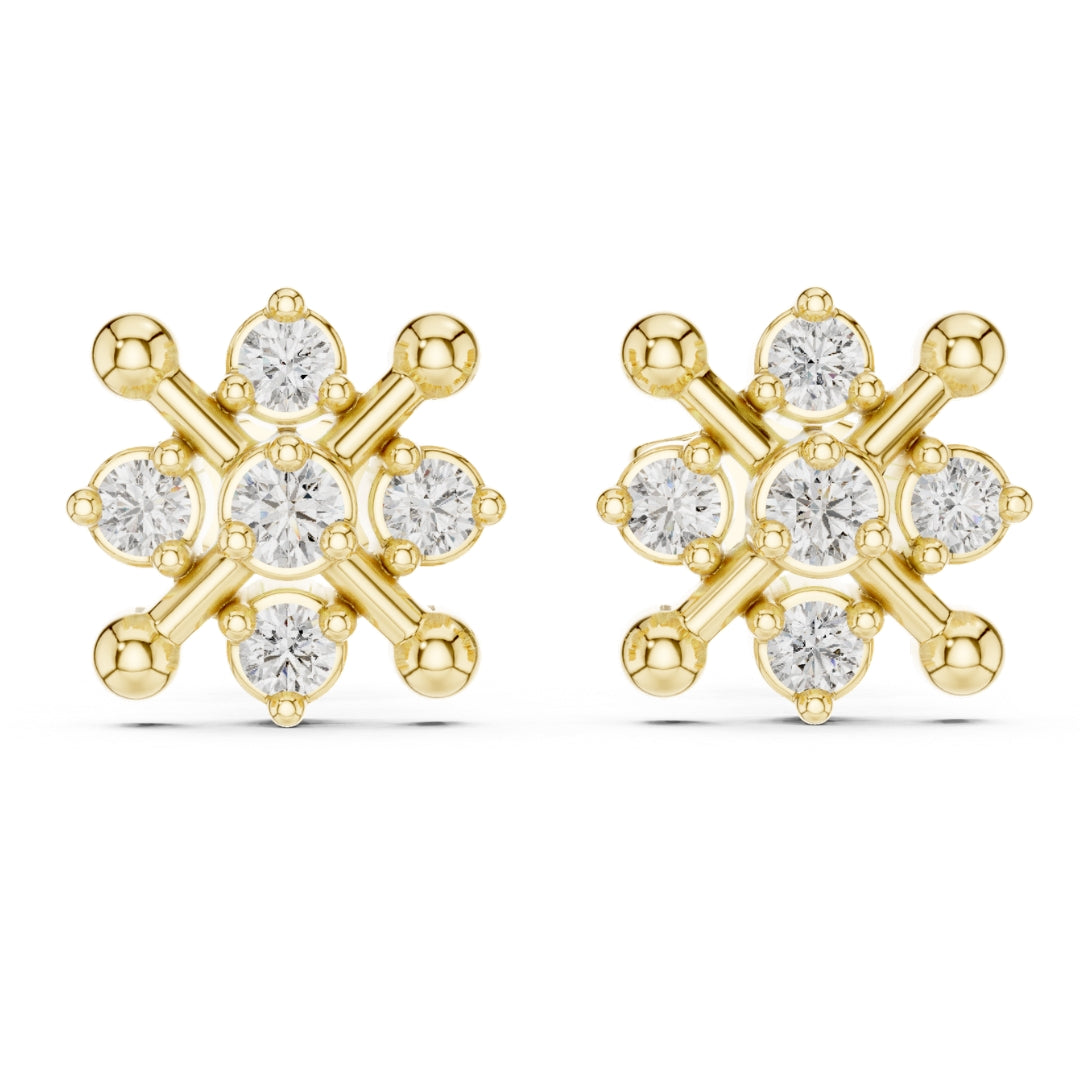 Gold finish and moissanite diamond earrings on a white background