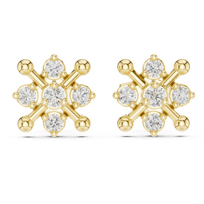 Gold finish and moissanite diamond earrings on a white background